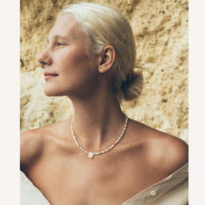 C.W. James Harmony zodiac necklace and Bianca necklace on model