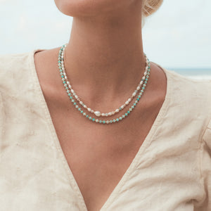 C.W.James Elodie Amazonite necklace and Harmony pearl necklace on model