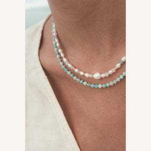C.W. James Harmony pearl and gemstone necklace and Elodie amazonite necklace on model close up