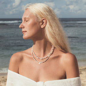 C.W. James Harmony zodiac necklace and rose quartz Solange necklace on model