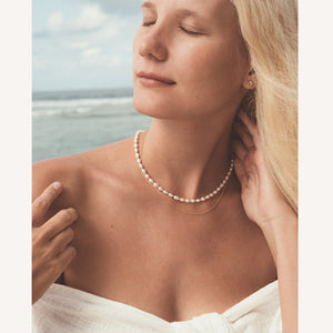 C.W. James Astrid pearl necklace and Bianca necklace on model